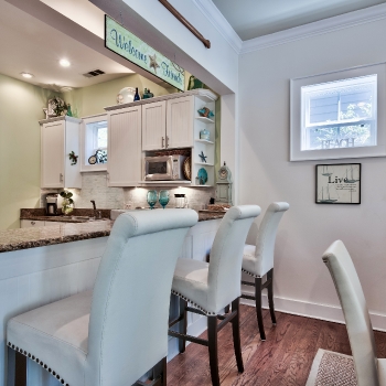 Kitchen counter space for three at the bar, washer/dryer behind kitchen